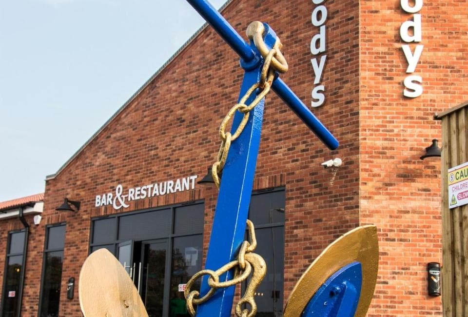 Woody's sign at The Chase